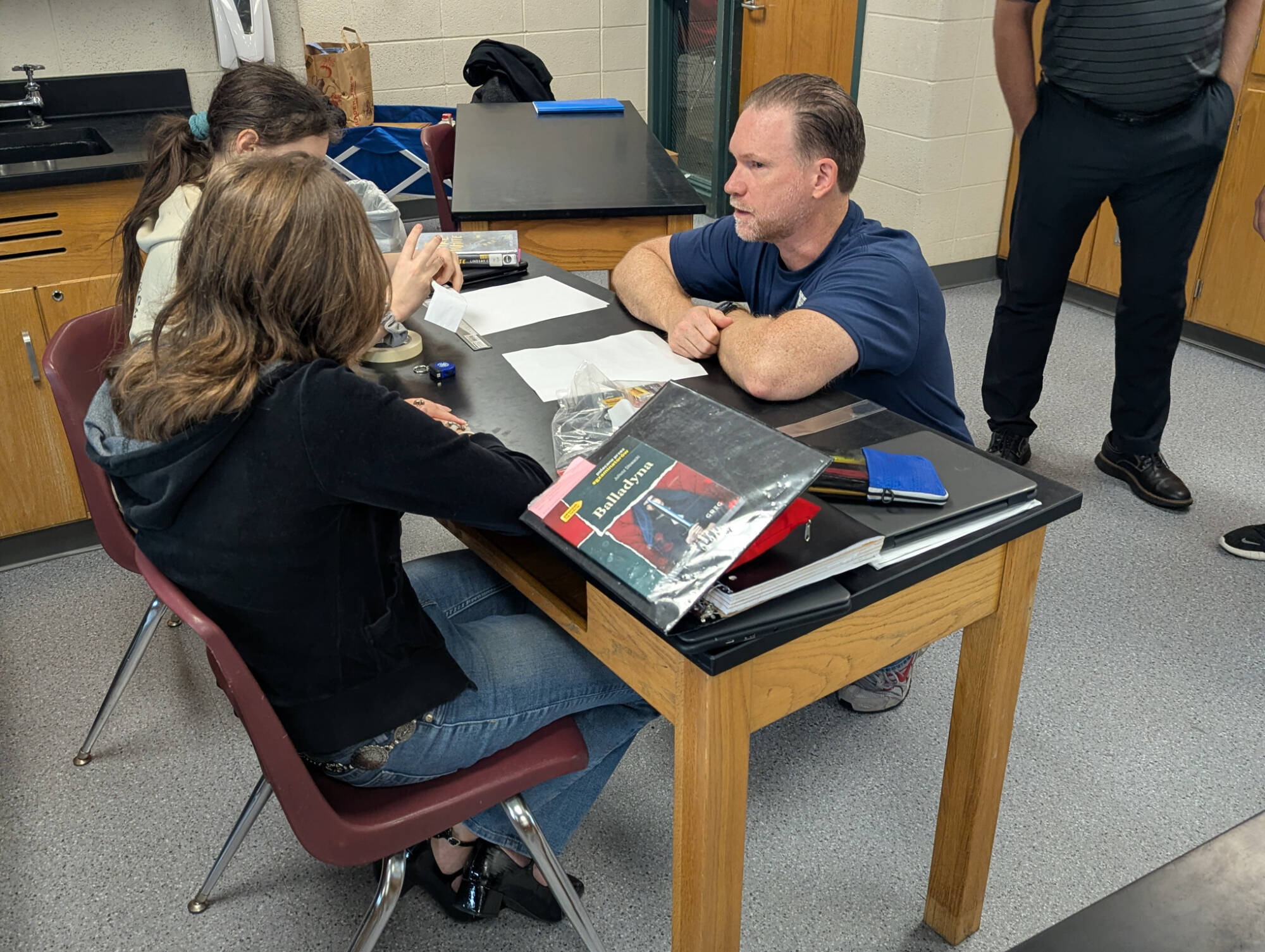 GE Aerospace volunteer engaging with 8th graders